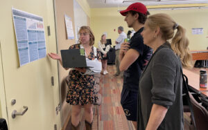 Wesleyan student presenting at a poster conference